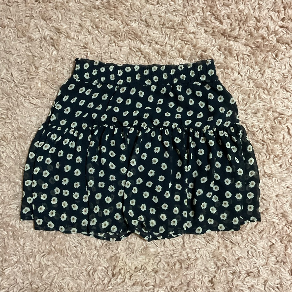 Hello! I am selling a skirt. It is layered and is black with flower designs.